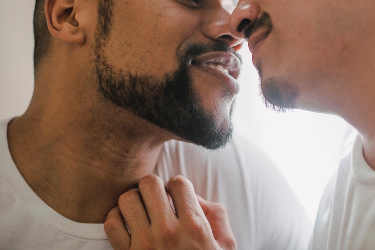 Two Unrecognizable Men Kissing