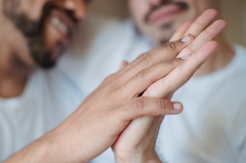 Free Two Men Holding Hands Stock Photo