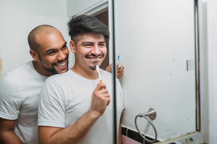 Couple Brushing Teeth Together