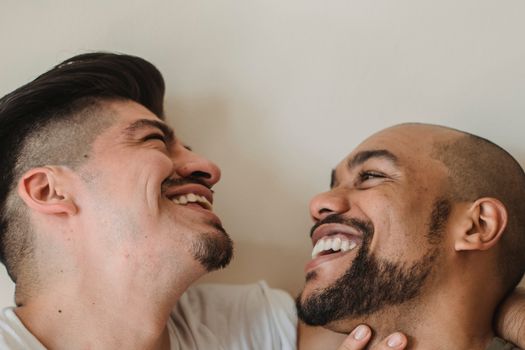 Portrait of Two Men Smiling at Each Other