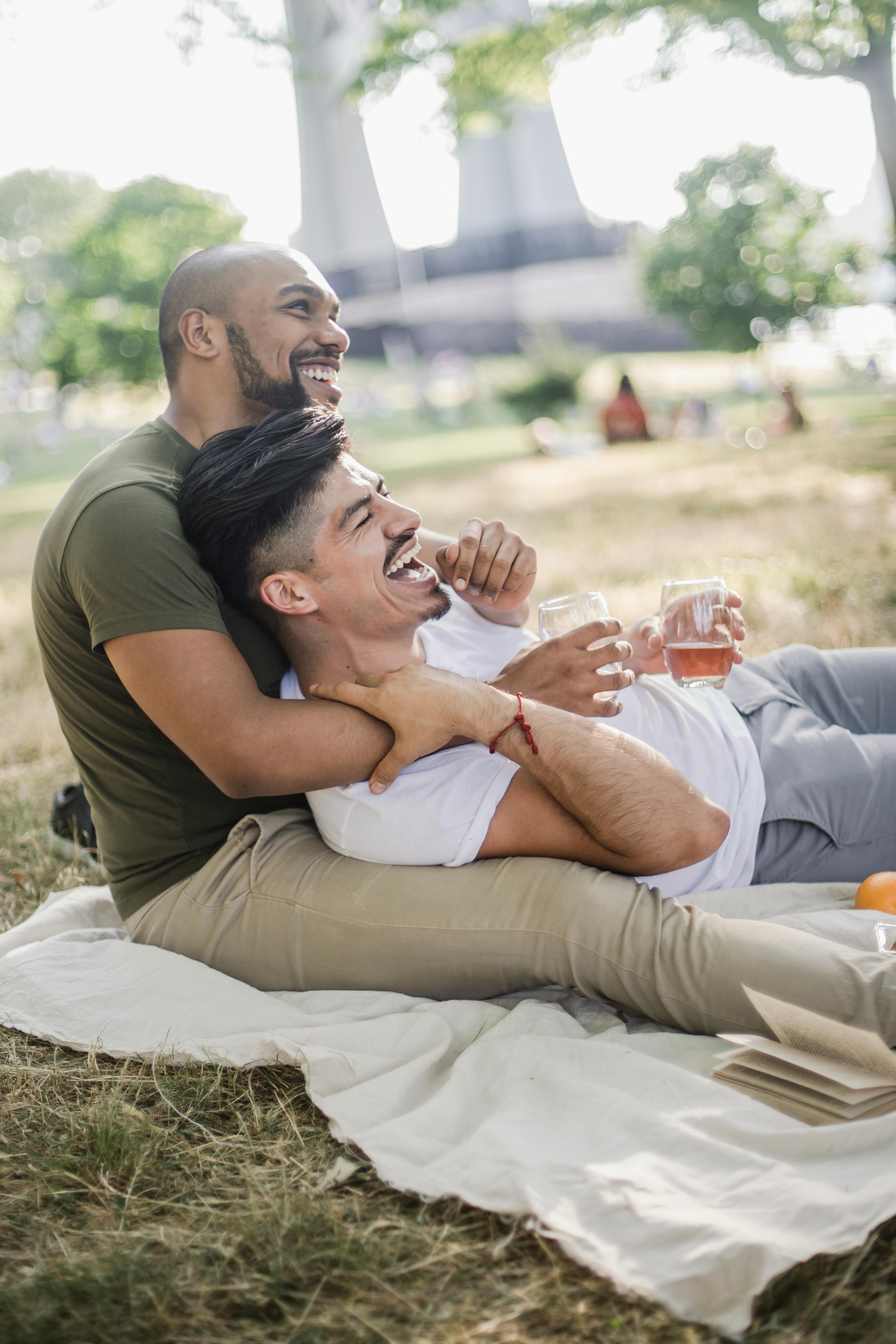 two happy men having a picnic