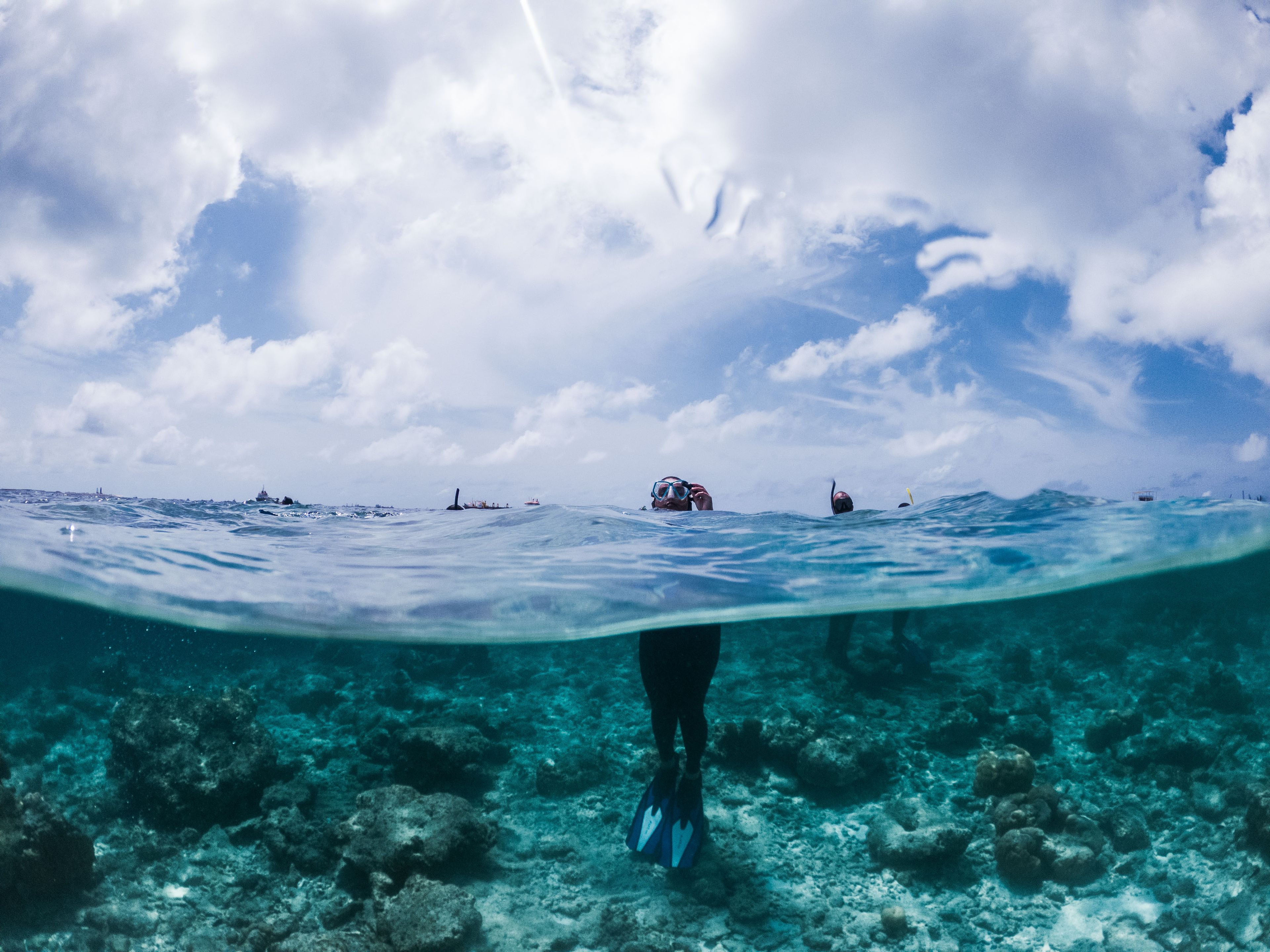 Direct ladder access from an overwater villa onto the house reef at a luxury Maldives resort