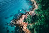Rocky shoreline near clear sea