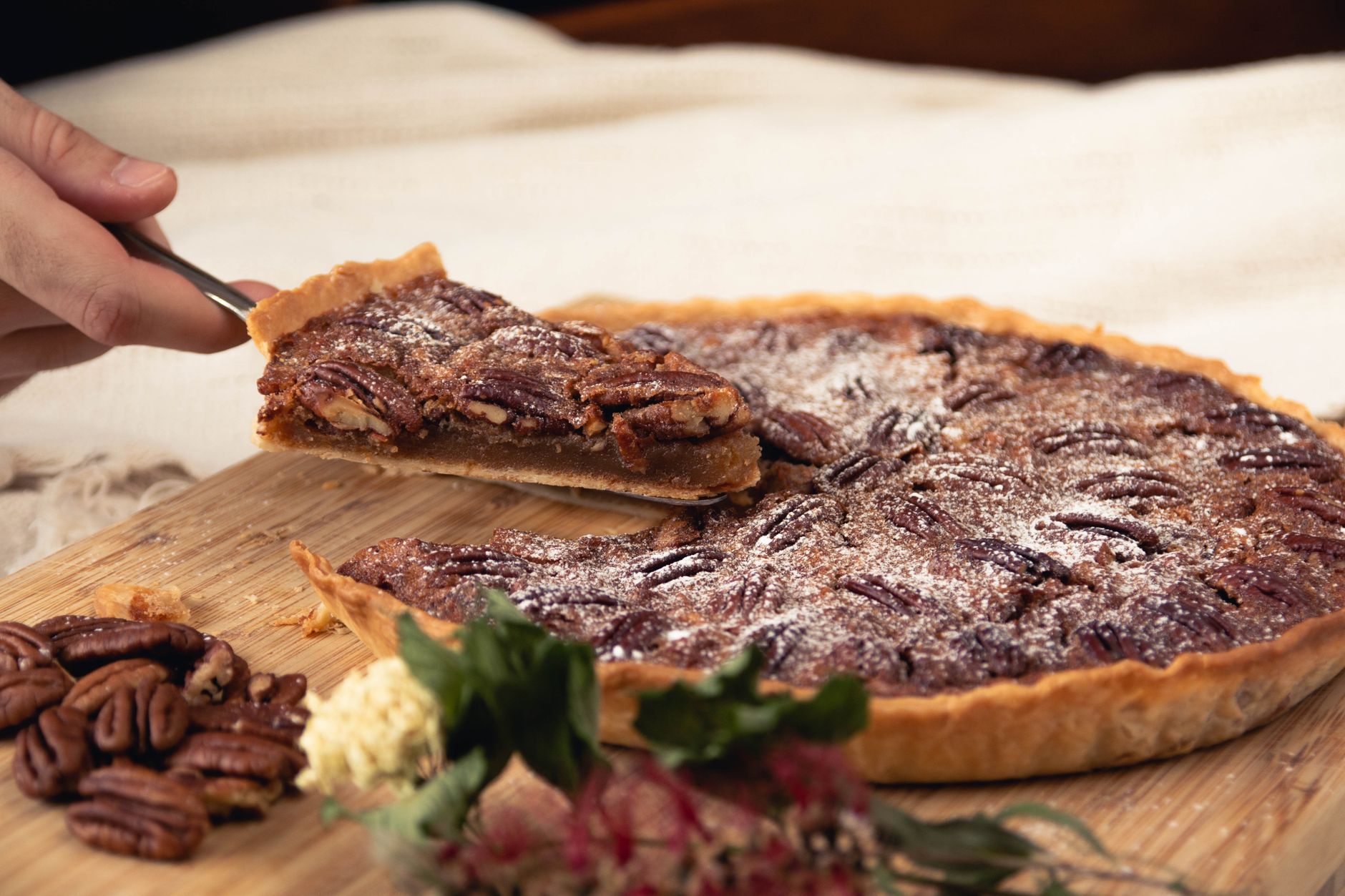 Sliced pecan coffee cake with visible nutty topping