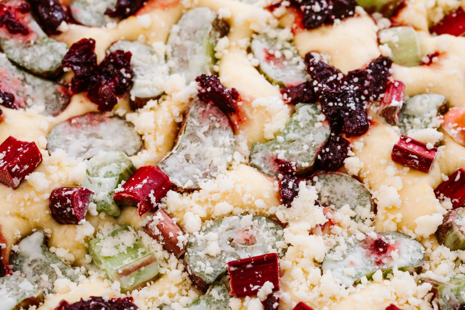 Rhubarb dessert with crumble and berries