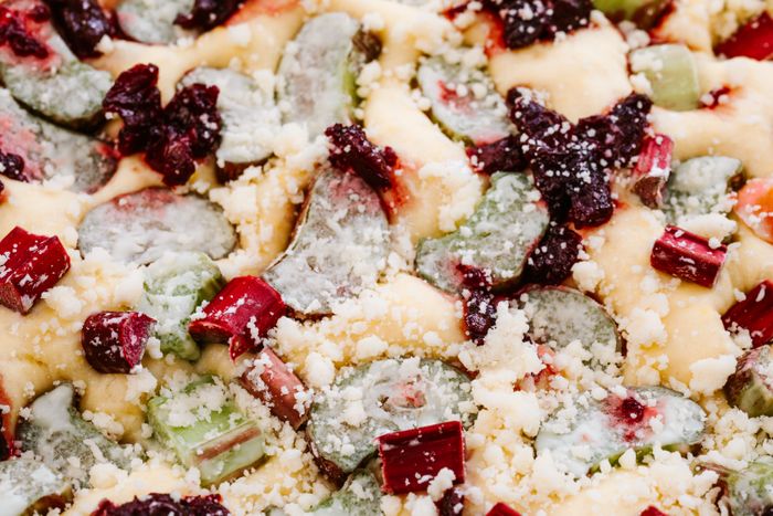 Rhubarb dessert with crumble and berries
