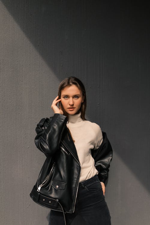 Free A Portrait of a Woman Wearing a Black Leather Jacket Stock Photo
