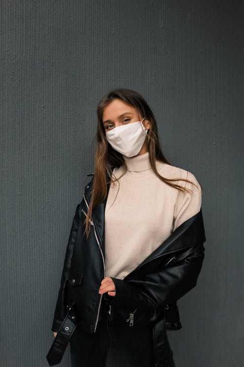 Free 
A Woman Wearing a Black Leather Jacket and a Face Mask Stock Photo
