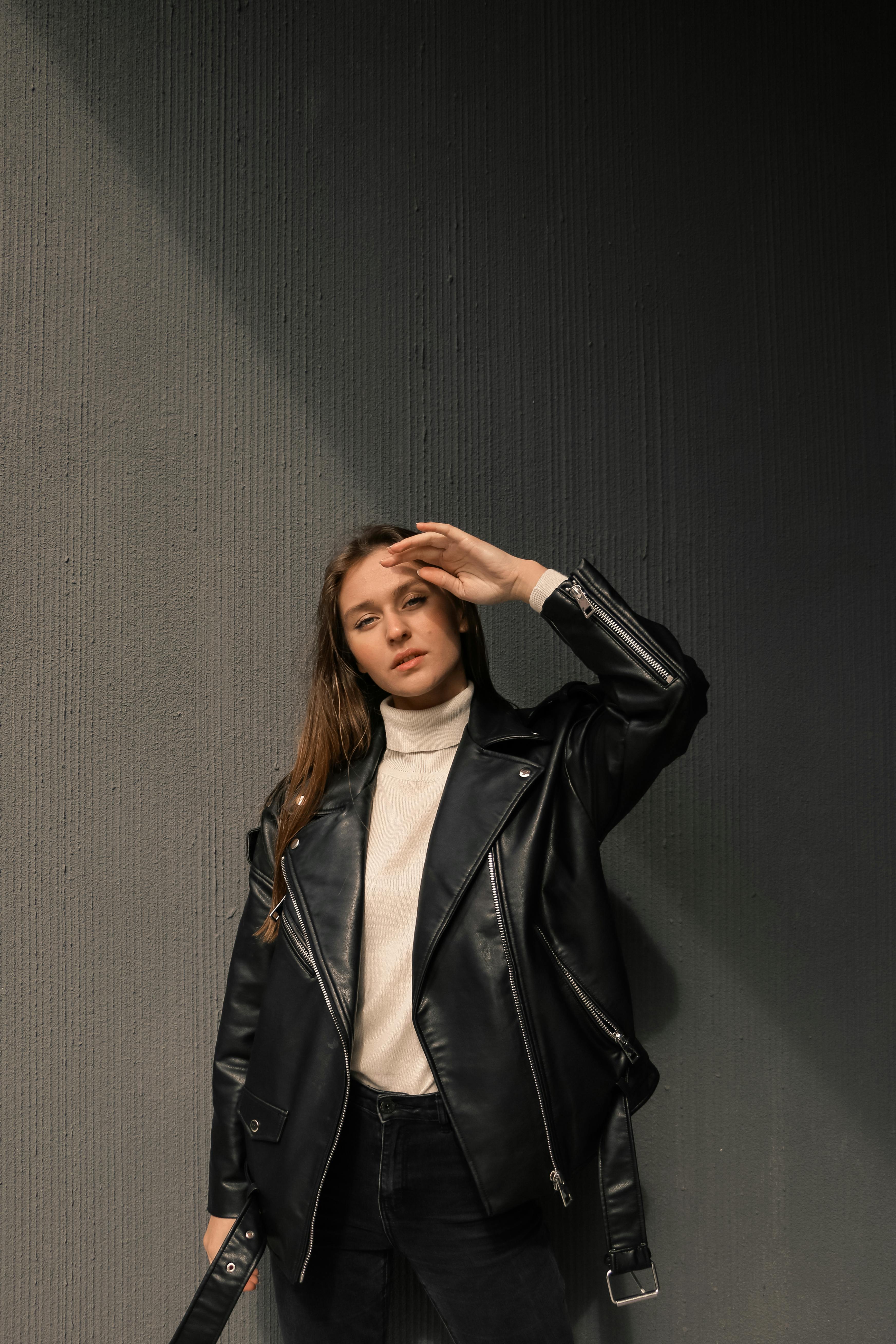 A Woman Wearing a Black Leather Jacket over a Turtleneck Sweater · Free