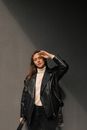 Woman in Black Leather Jacket Standing and Smiling