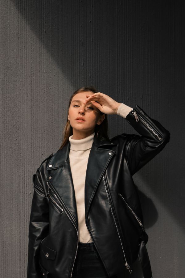 Woman in leather jacket relaxed style