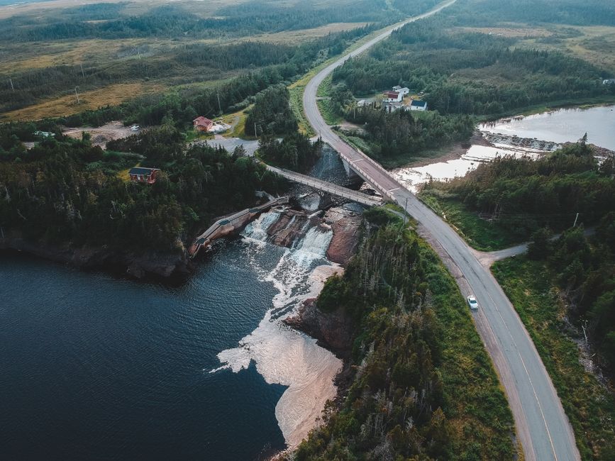 Outstanding 20 km Helicopter Tour over Toronto Review: Soaring Above Canada's Iconic Skyline Review 2026 - Aerial view of roadway with bridge above river with waterfalls and sea near greenery trees in mounts