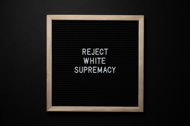 Chalkboard With REJECT WHITE SUPREMACY Inscription