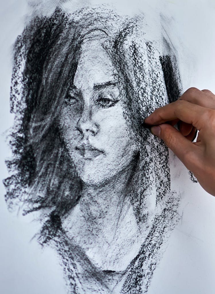 Artist Drawing Portrait With Pencil On Paper