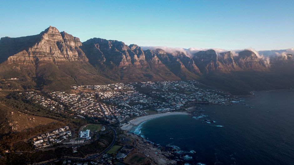 Spectacular Cape Town 3-Day Attraction Tours: Side Car Adventures, Helicopter Tour, Cape Point Review Review 2026 - Scenic aerial view of Cape Town, featuring Table Mountain and the Atlantic Ocean coastline.