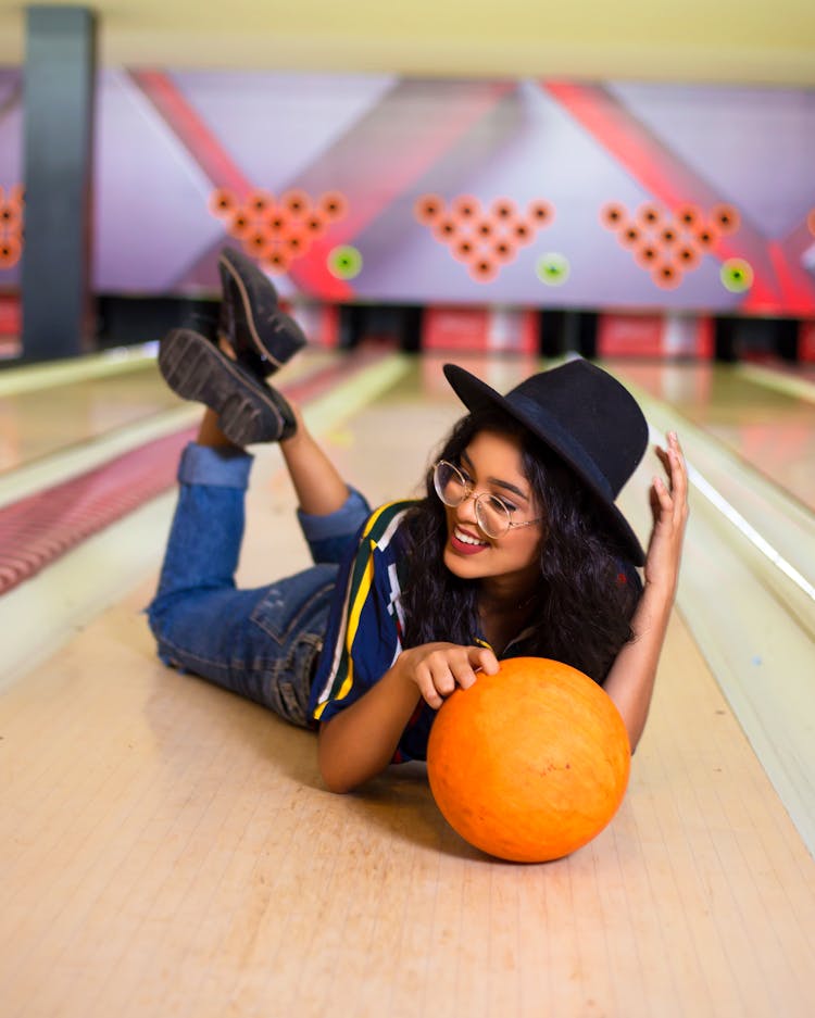 Happy Ethnic Woman On Bowling Lane