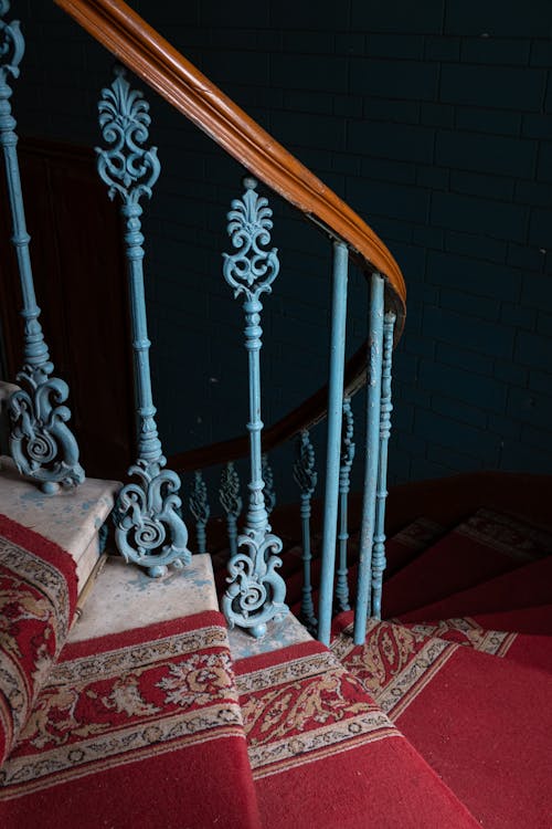 Brown Wooden Staircase With Brown Steel Railings