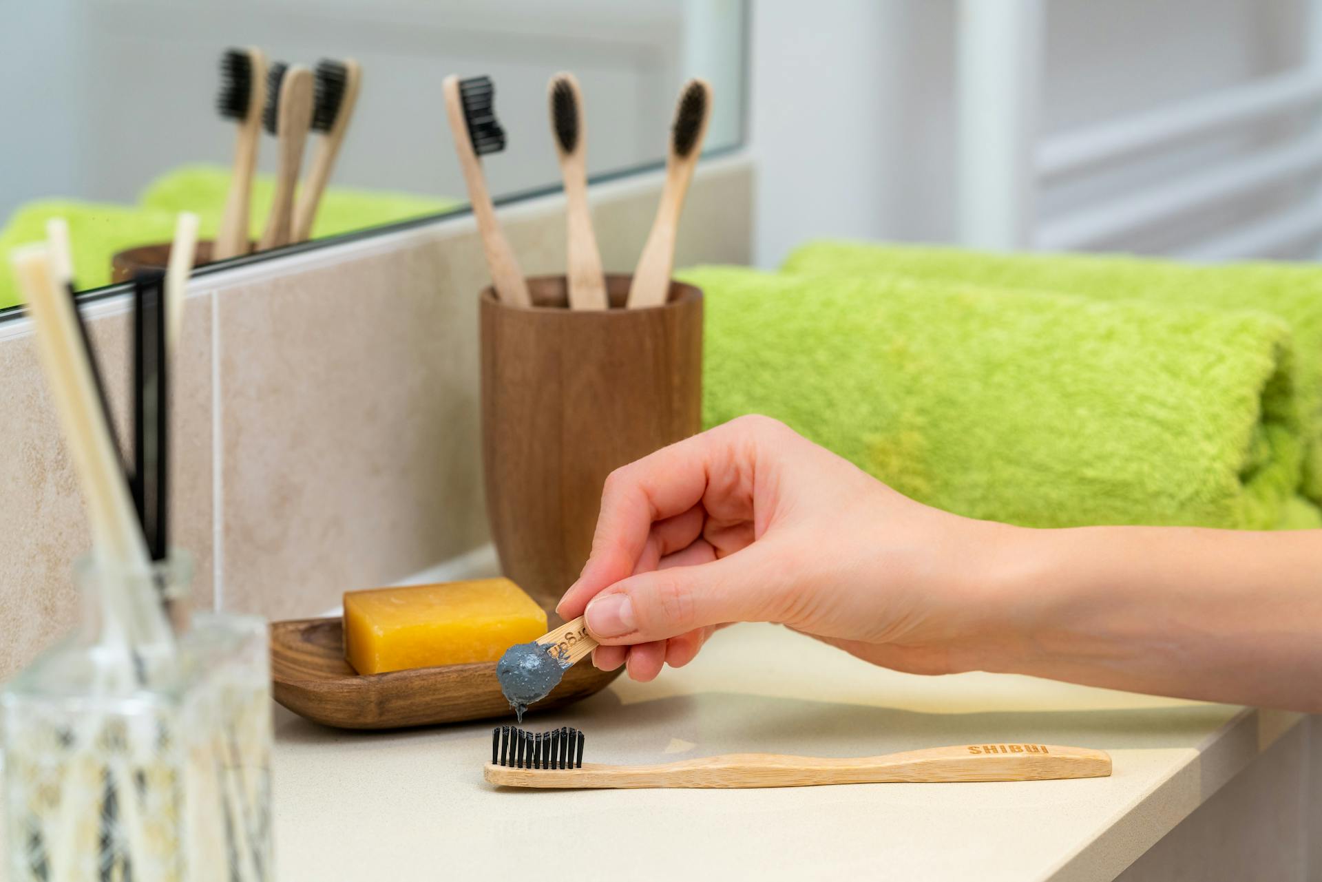 Person Holding Brown Wooden Rolling Pin