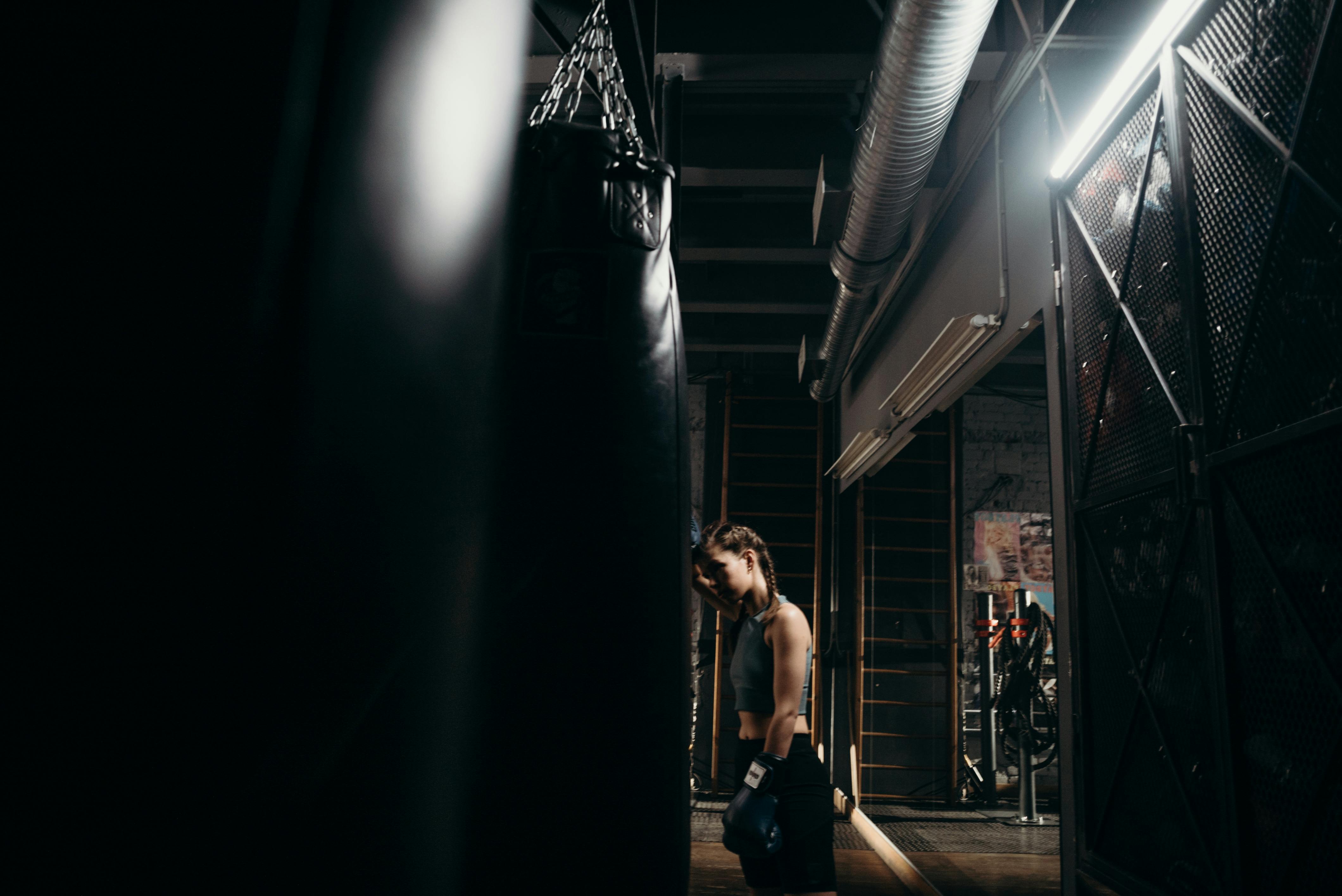 Man in his 40s doing bodyweight squats at home