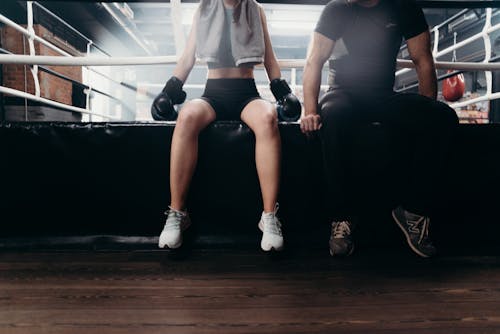 Free 2 Women in White Shirt and Black Shorts Doing Exercise Stock Photo
