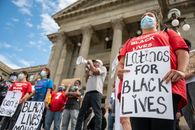 Unrecognizable person with sign on protest
