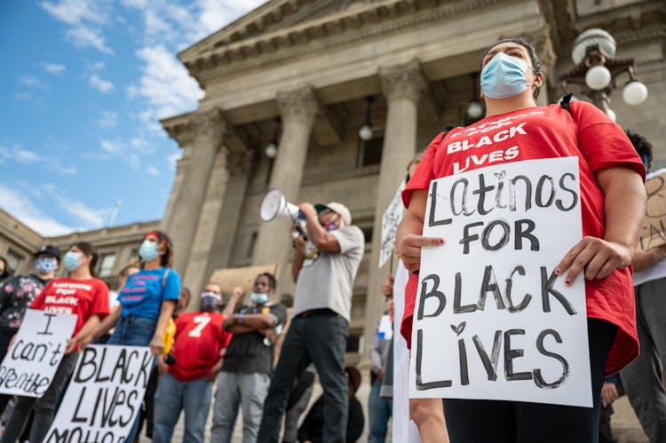 Unrecognizable Person With Sign On Protest