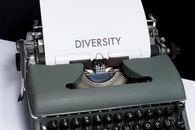 Green and White Typewriter on Table