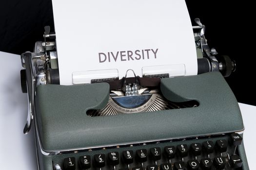 Green and White Typewriter on Table