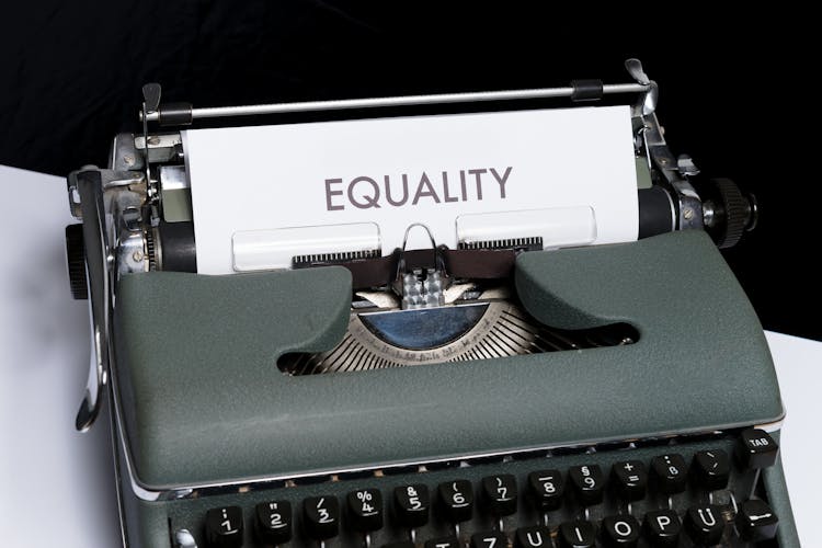 Green Vintage Typewriter With Equality Typed On Bond Paper