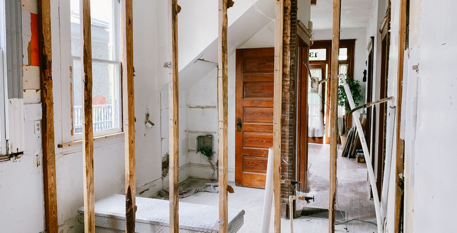 Interior of a Malaysian home mid-renovation with exposed beams — fresh gaps that pests use as entry points