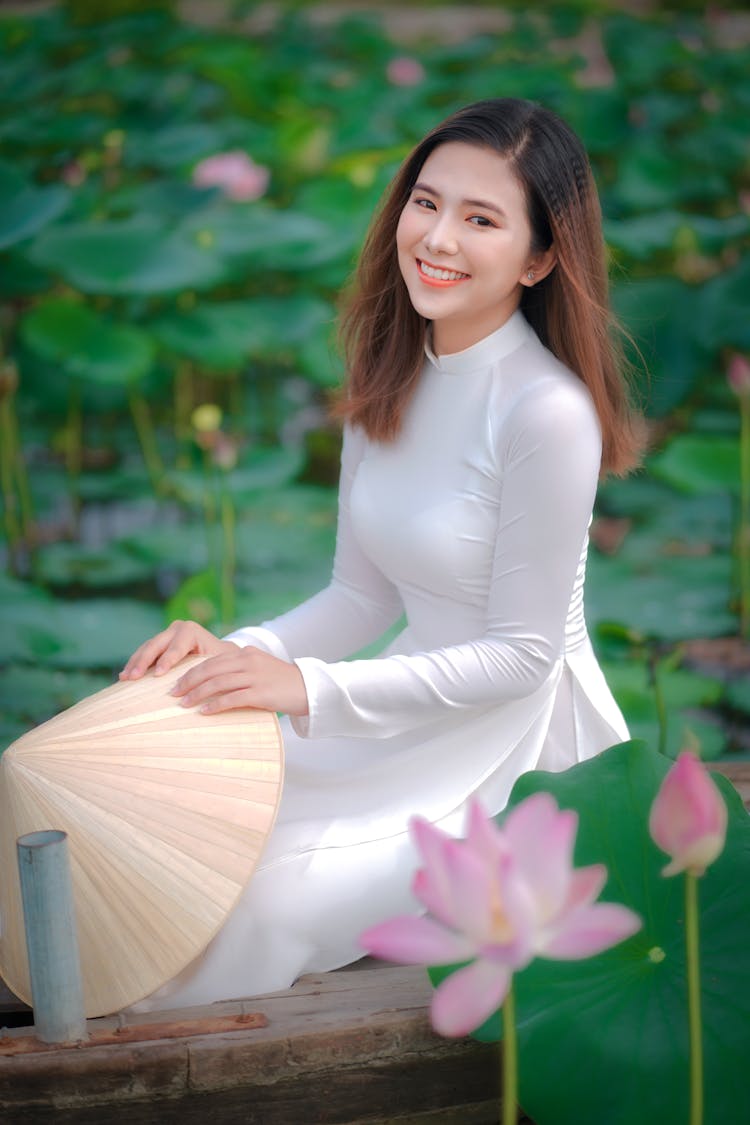 Woman On Wooden Surface In Water Lilies