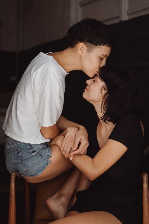 Free Tender moment of affection between two women indoors, showcasing love and connection. Stock Photo