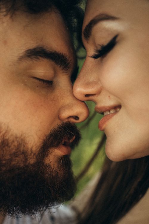Free A tender moment captured in a close-up shot of a couple with eyes closed, expressing love and connection. Stock Photo