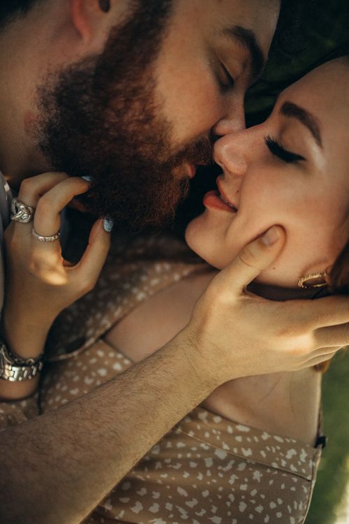Free Intimate close-up of a couple sharing a tender moment outdoors, exuding love and affection. Stock Photo