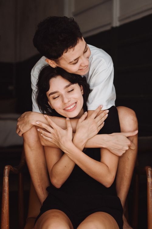 Free A happy couple embracing indoors, showcasing love and intimacy. Stock Photo