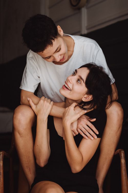 Free A joyful couple shares an intimate moment indoors, showcasing love and happiness. Stock Photo
