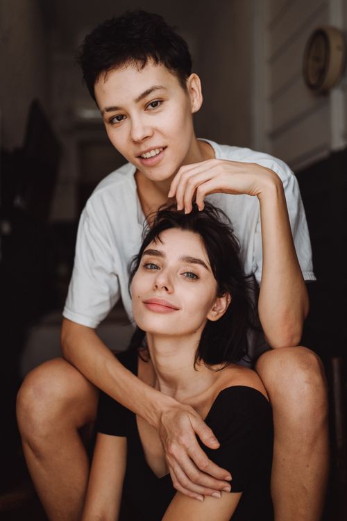 Free A close-up intimate portrait of a happy couple embracing indoors. LGBTQ representation. Stock Photo