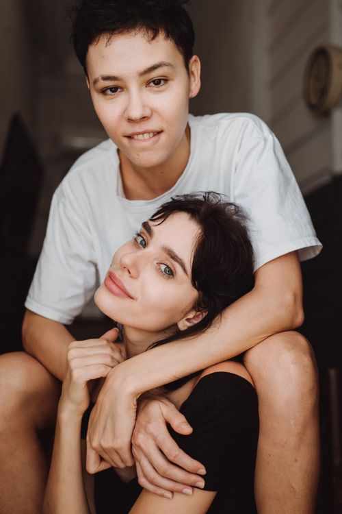 Free Charming portrait of a loving couple embracing indoors, showcasing affection and happiness. Stock Photo