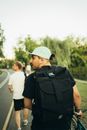 Man in Black Shirt Carrying Black Backpack