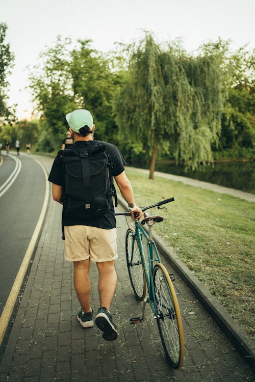 adam, arkadan görünüm, bisiklet içeren Ücretsiz stok fotoğraf