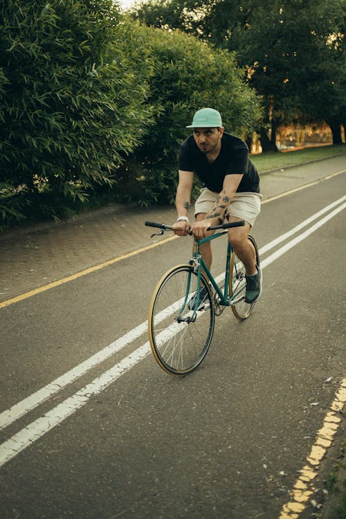 Photo of a Man Riding a Bicycle