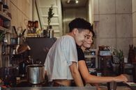 Man in White T-shirt Standing in Kitchen