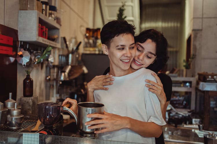 Couple Hugging In Kitchen