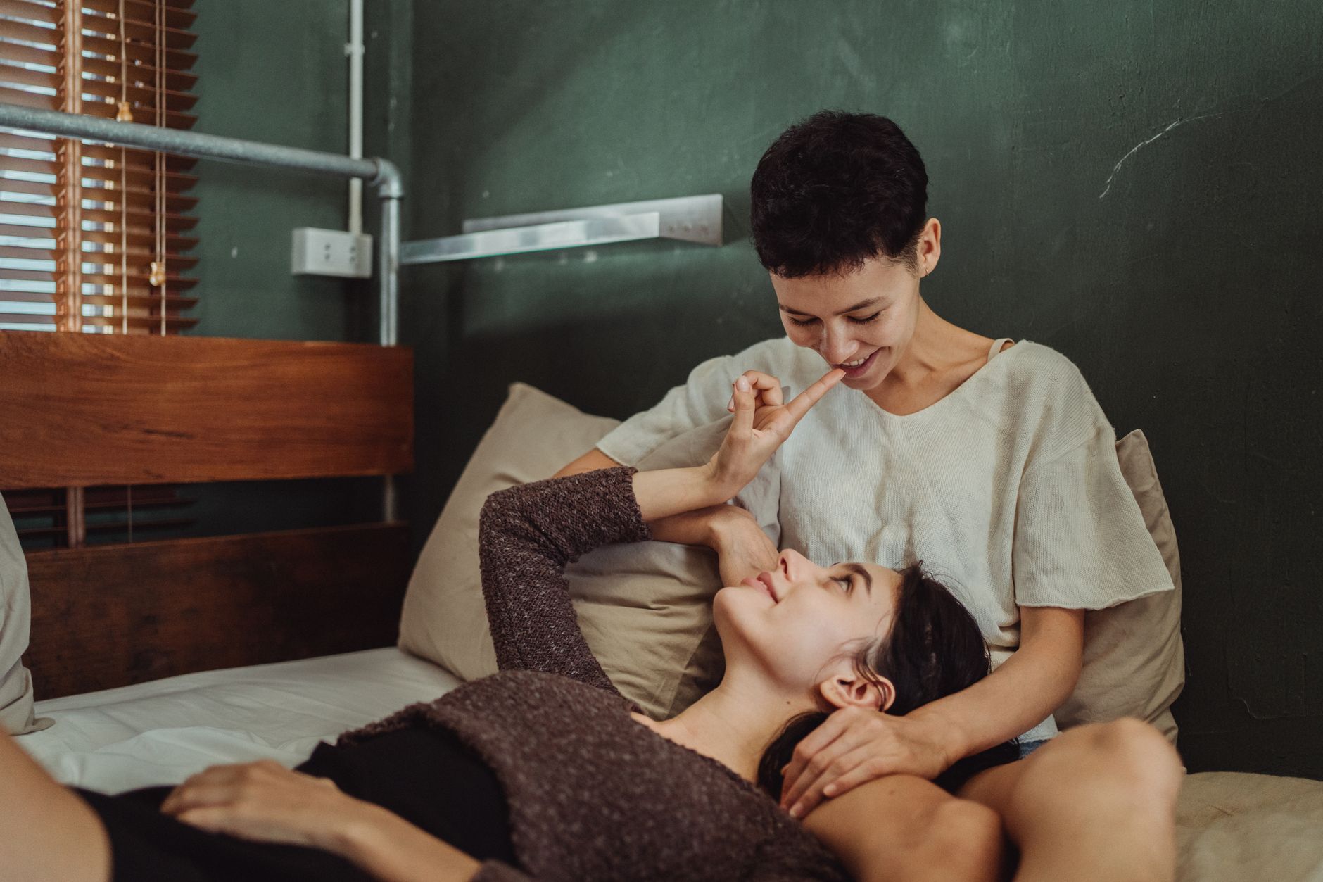 A joyful couple sharing an intimate and loving moment at home, radiating warmth and connection.