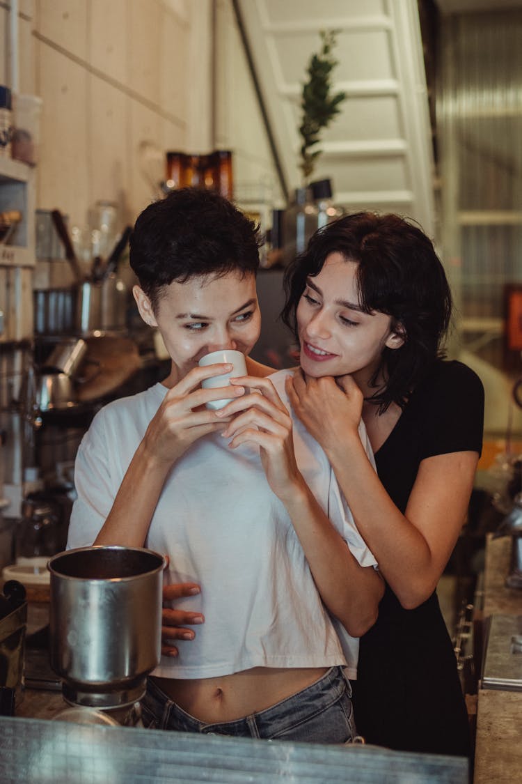 Woman Drinking Coffee In Bar