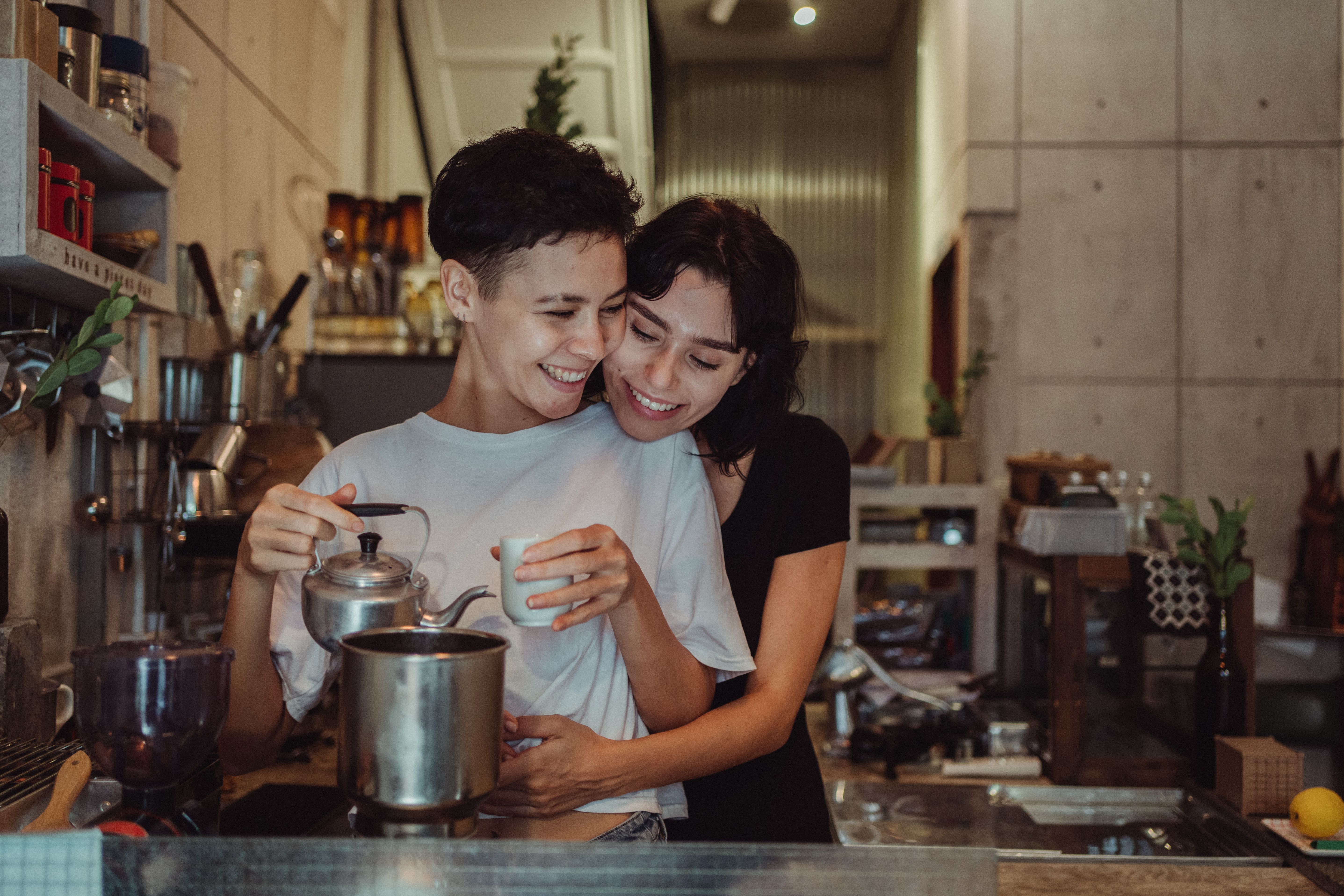 Couple using relationship app together on smartphone
