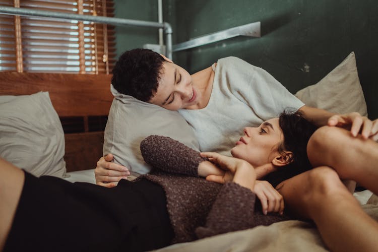 Couple Talking In Bed