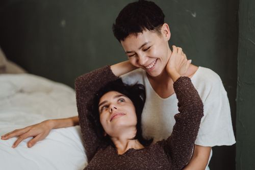 Free Happy couple embracing, sharing a joyful moment indoors. Stock Photo