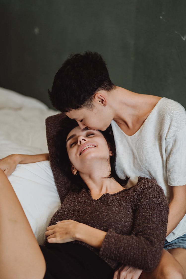 Woman Kiss Her Partner On Forehead