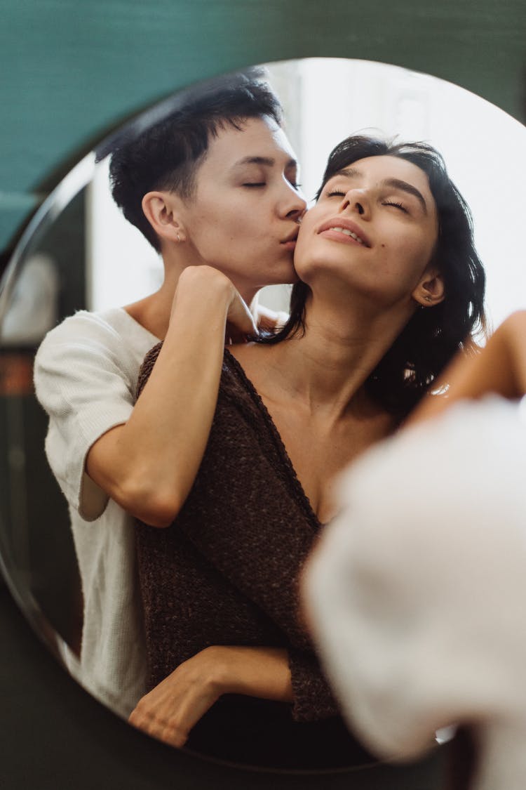 Mirror Reflection Of Kiss On Cheek